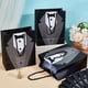thumbnail image 4 of Paquete de 12 bolsas de regalo para esmoquin, de 23 x 19 x 8,9 cm, de papel blanco y negro con asa para padrinos de boda, despedidas de soltero y regalos de boda., 4 of 5