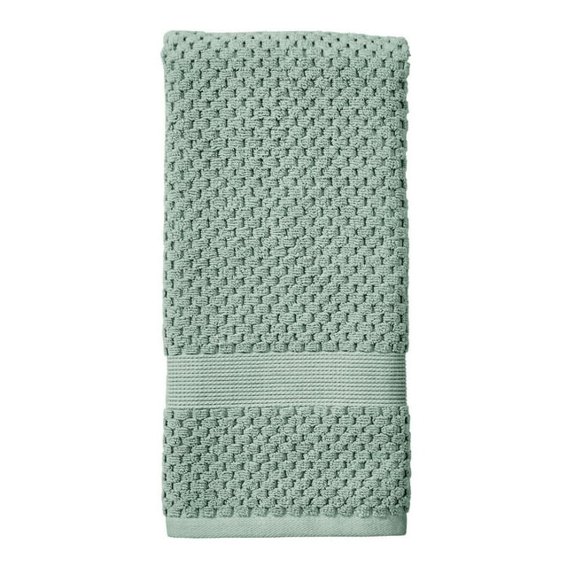 Folded Better Homes & Gardens Signature Soft Popcorn Texture Towel in light green with textured pattern and ribbed band