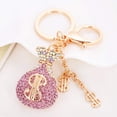 thumbnail image 1 of Llavero con colgante de bolso con forma de signo de dólar y diamantes de imitación de cristal para mujeres y niñas (rosa), 1 of 2