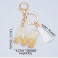 thumbnail image 4 of Llavero de letras brillantes con borla blanca, colgante de cristal epoxi, 26 letras del alfabeto inglés, regalo pequeño para bolso de pareja, 4 of 4