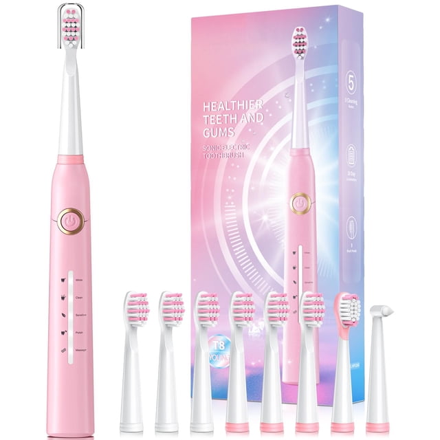 cepillo de dientes eléctrico teetheory con 8 cabezales de 40000 vpm Rosa; vista frontal centrada del cepillo sónico recargable con botón circular dorado y cinco indicadores de modo; ocho cabezales Dupont en forma W, cabezal raspador de lengua y cabezal interdental alineados delante, caja de empaque rosada al fondo. Temporizador inteligente de 2 minutos y carga USB de 4 horas para hasta 30 días de uso; frecuentemente usado para viajar con la funda protectora incluida.