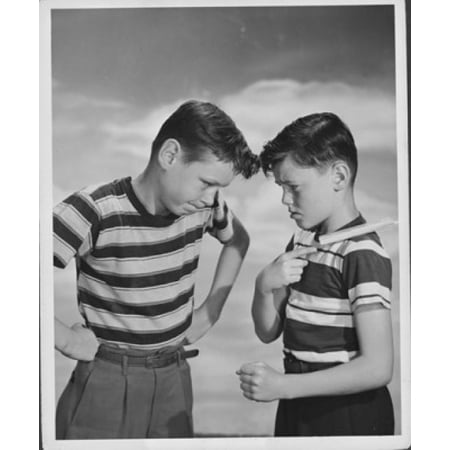 Boy daring another boy to knock a chip off his shoulder Stretched Canvas -  (18 x