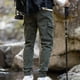 thumbnail image 4 of Pantalones largos de moda para hombre, casuales, de color sólido, con bolsillos cargo y cintura elástica, de poliéster., 4 of 7