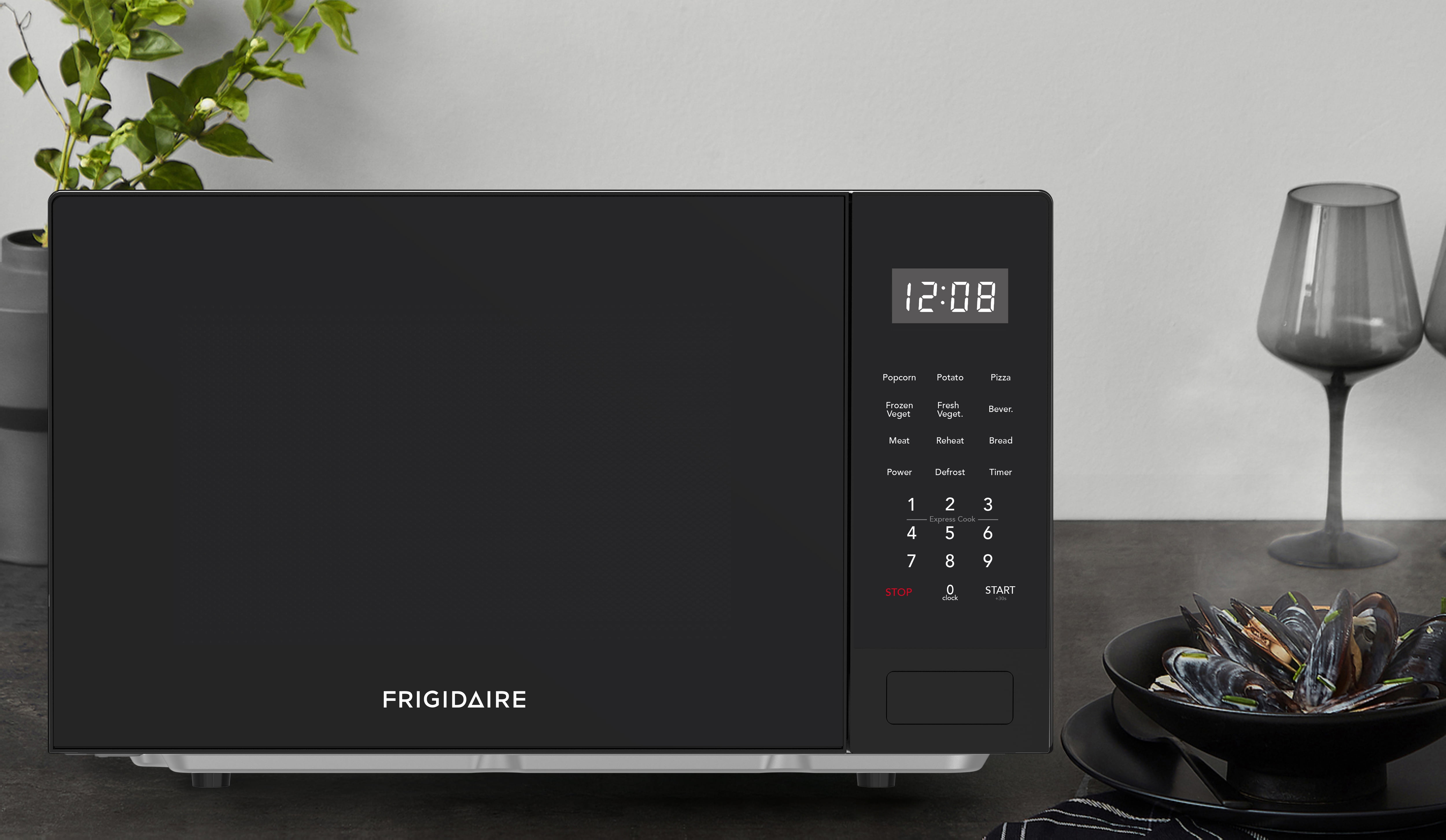 Frigidaire 0.9 Cu. ft. Countertop Microwave Oven, 900 Watt Microwave with 10 Power Levels, Black
