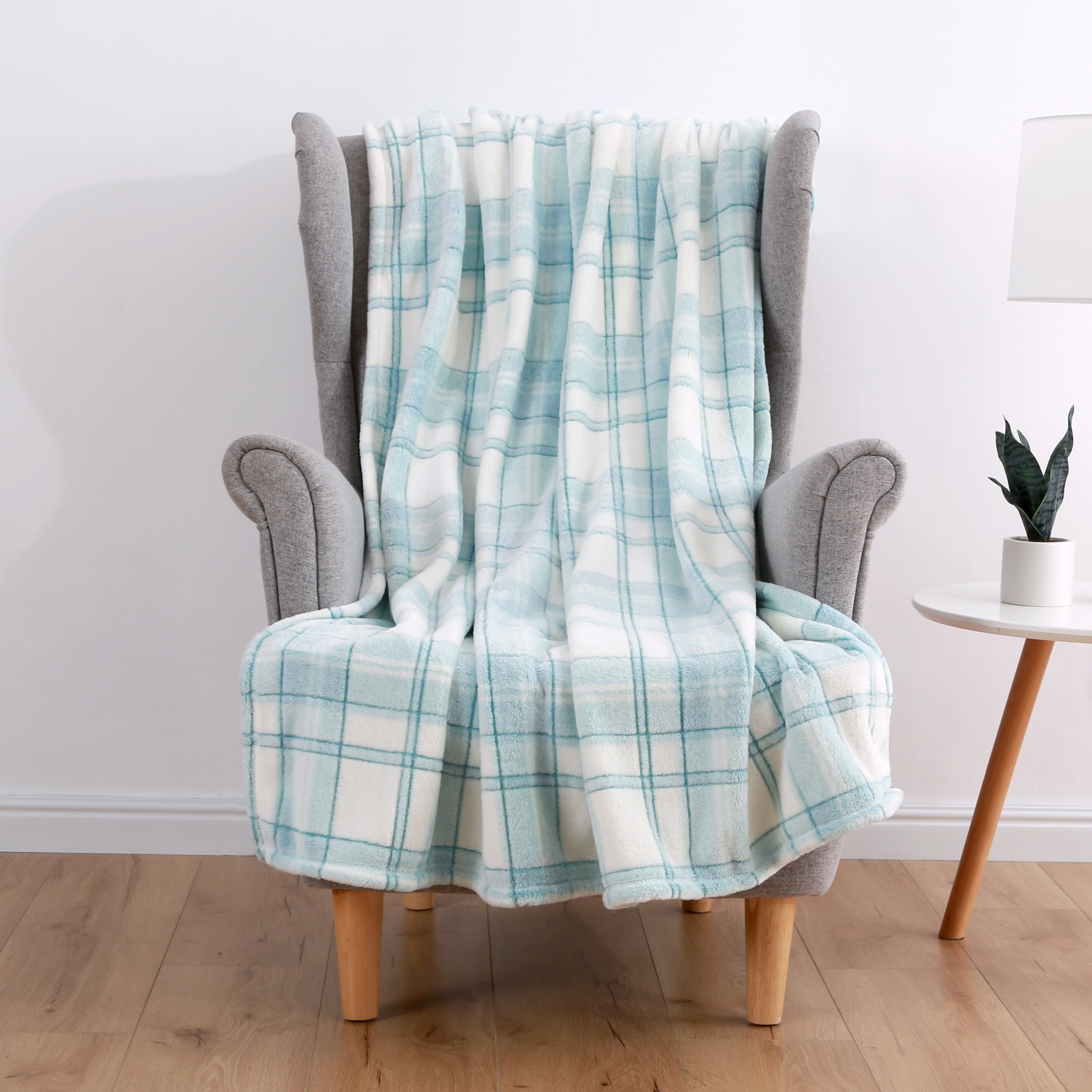 Mainstays Plush Throws, 50" x 60", Aqua Plaid machine wash in cold water and tumble dry on low.