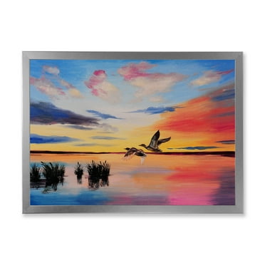 Designart 'Crane Birds Flying During Colorful Sunset' Nautical & Coastal Framed Art Print