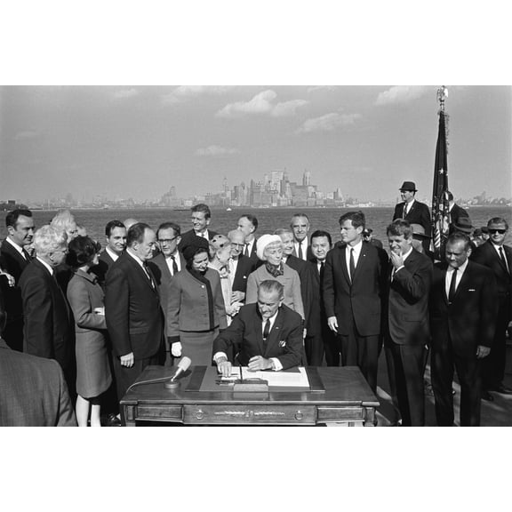 24x36 gallery poster, President Lyndon B. Johnson signs the Immigration Act of 1965 as Ted and Robert Kennedy and others look on