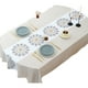 thumbnail image 1 of Se producen flores de colores vivos bordadas con un mantel ovalado de color blanco cremoso., 1 of 5