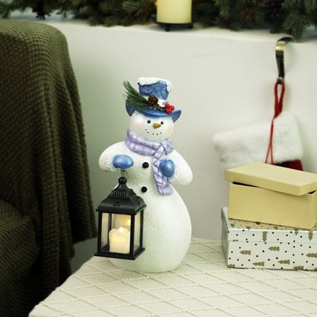 Alpine Corporation SKY562HH-S-TM Lavender Winter Snowman Holding Lantern Statue with Flashing Warm White LED Candle, 14” Tall, Indoor/Outdoor Holiday Decoration , Christmas Decoration