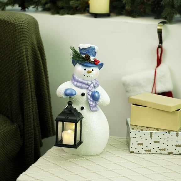 Alpine Corporation SKY562HH-S-TM Lavender Winter Snowman Holding Lantern Statue with Flashing Warm White LED Candle, 14” Tall, Indoor/Outdoor Holiday Decoration , Christmas Decoration