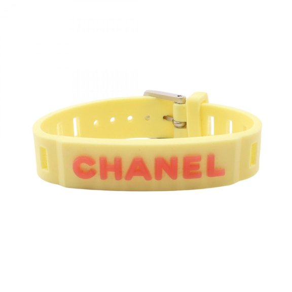 Pre-Owned Chanel rubber band bracelet accessory for women, available in yellow and orange tones.