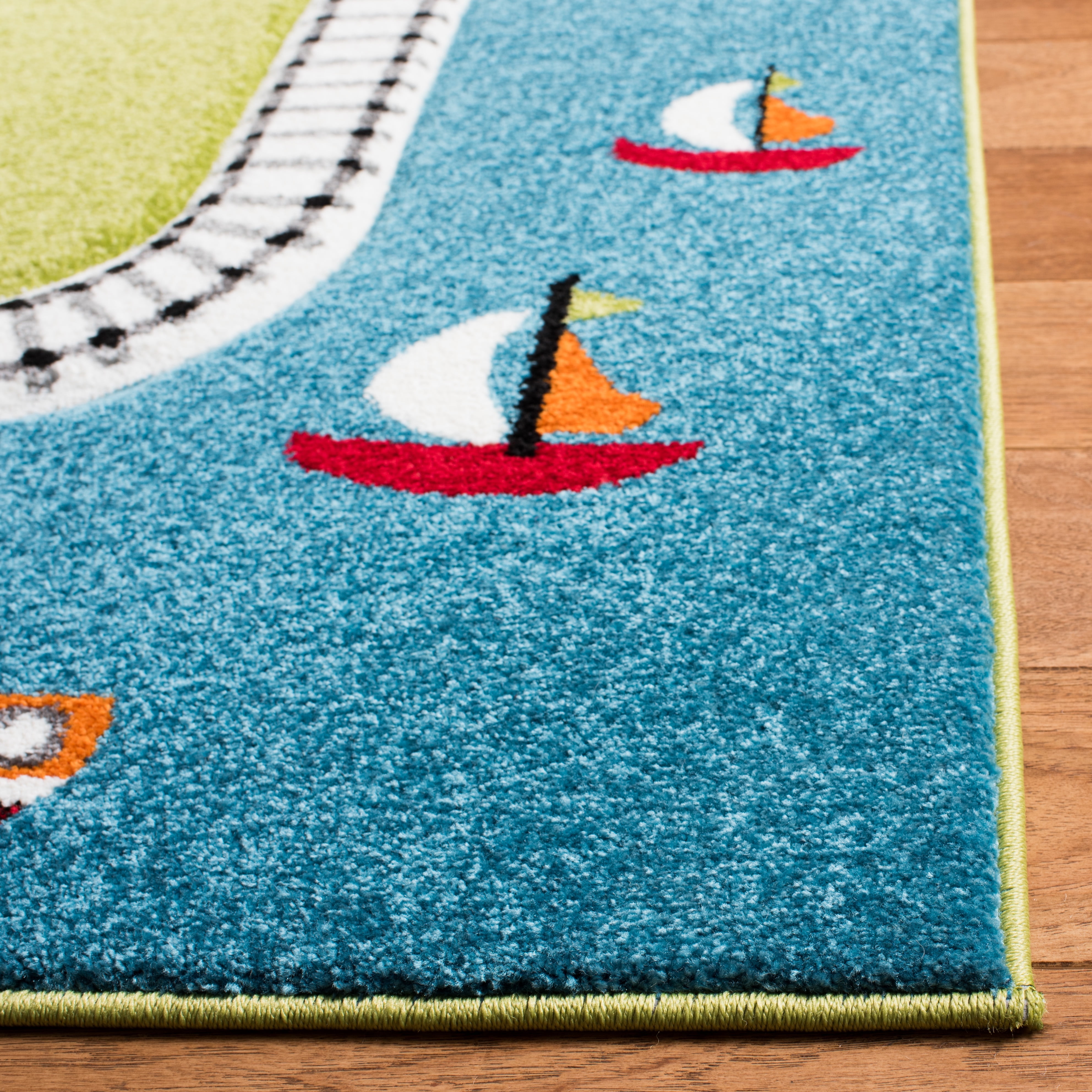 SAFAVIEH Carousel Kids Devan Train Track Area Rug, Green/Ivory, 5'3" x 7'6"