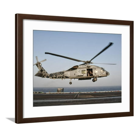 Navy Flight Deck - A US Navy SH-60F Seahawk Hovers Above the Flight Deck of USS Eisenhower Framed Print Wall Art By Stocktrek Images