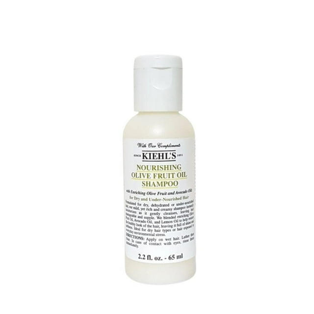 champú de aceite de oliva nutritivo kiehl's 65ml botella frontal, envase cilíndrico blanco con tapa abatible y etiqueta con texto negro y dorado que muestra la marca y la capacidad 65 ml; formato compacto apto para llevar en viajes.