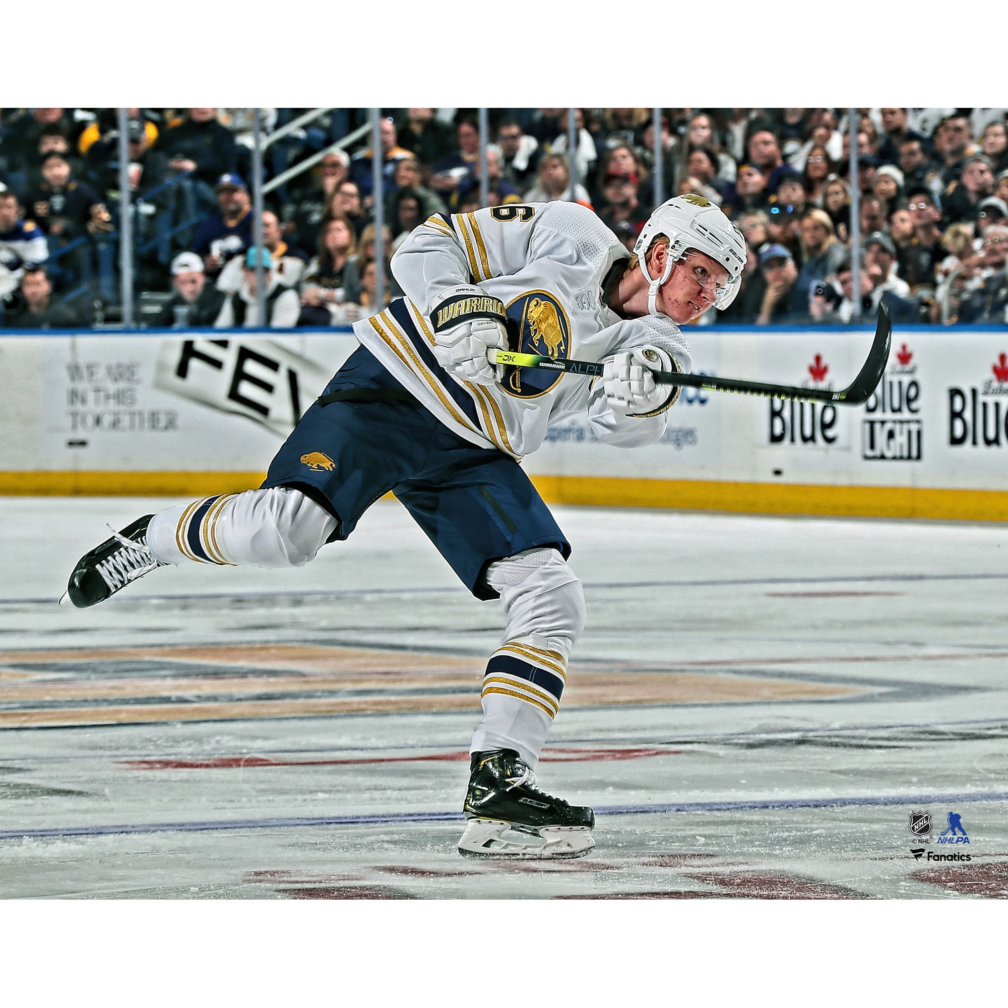 Dylan Cozens Buffalo Sabres Autographed 16 x 20 Blue Jersey Skating with Puck Photograph
