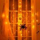 thumbnail image 3 of Luz LED de telaraña negra de Halloween con 70 luces de red LED naranjas impermeables y 1 araña negra para el hogar, jardín, interior y exterior, tema aterrador de Halloween, 3 of 5