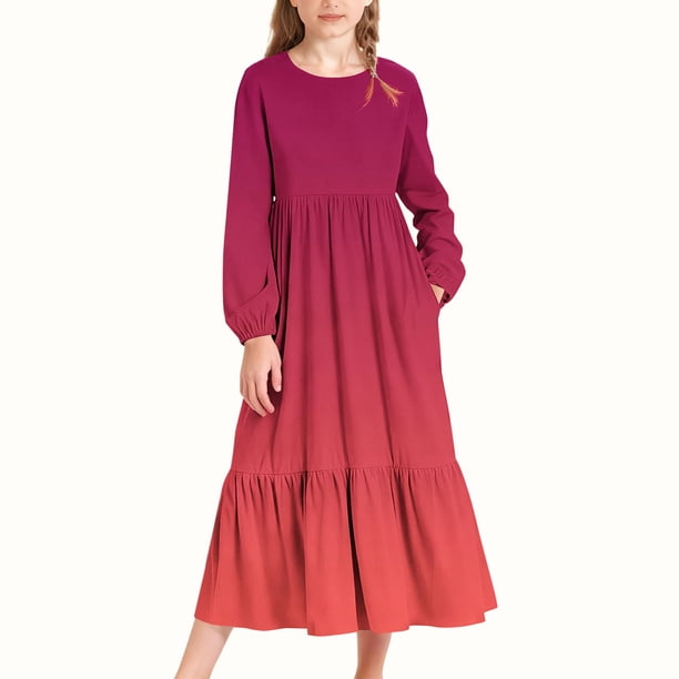 Vestido infantil de poliéster de manga larga, cuello redondo, bolsillos laterales y falda larga.