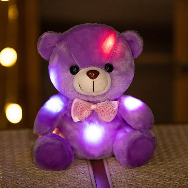 Osito de peluche con lazo luminoso que cambia de color. Ideal como regalo de Navidad o cumpleaños.