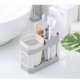 thumbnail image 1 of INTBUYING - Soporte para cepillo de dientes y pasta de dientes de una sola taza, organizador de almacenamiento de plástico para baño, 1 of 8
