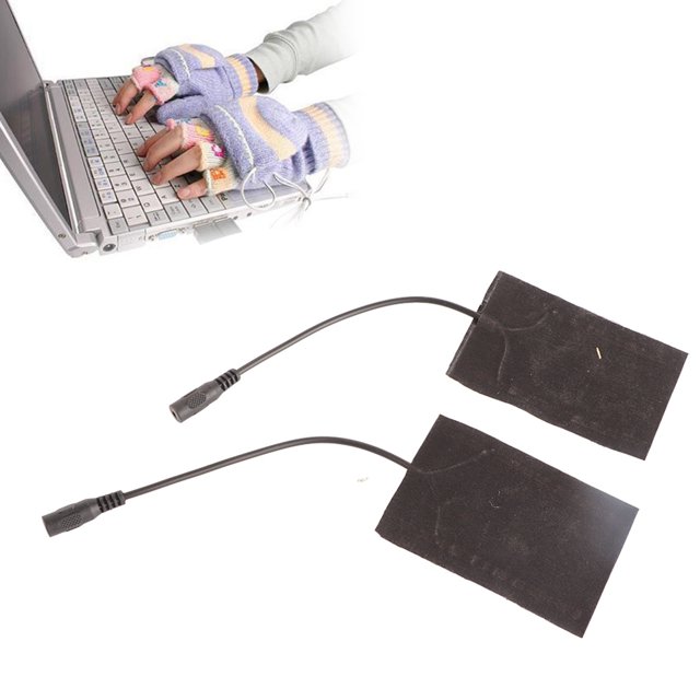 Portable 5V carbon pad hand warmer USB electric heating pad set, featuring two black carbon fiber heating pads with attached wires. The pads are lightweight, compact, and designed for USB-powered heating, suitable for gloves or other split-type heating applications. Shown in use with a person typing on a laptop while wearing fingerless gloves.