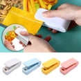 thumbnail image 1 of Mini sellador de bolsas pack de 2 • Prensa manual portátil para bolsas de plástico • Sellador térmico alimentado por pilas • Base magnética para frigorífico • Herramienta 2 en 1 para cortar y sellar, 1 of 9