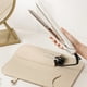 thumbnail image 5 of Bolsa portátil para almacenar rizador y plancha de pelo con aislamiento térmico, doble bolsillo, diseño plegable y cubierta protectora para uso en viajes y hogar., 5 of 7