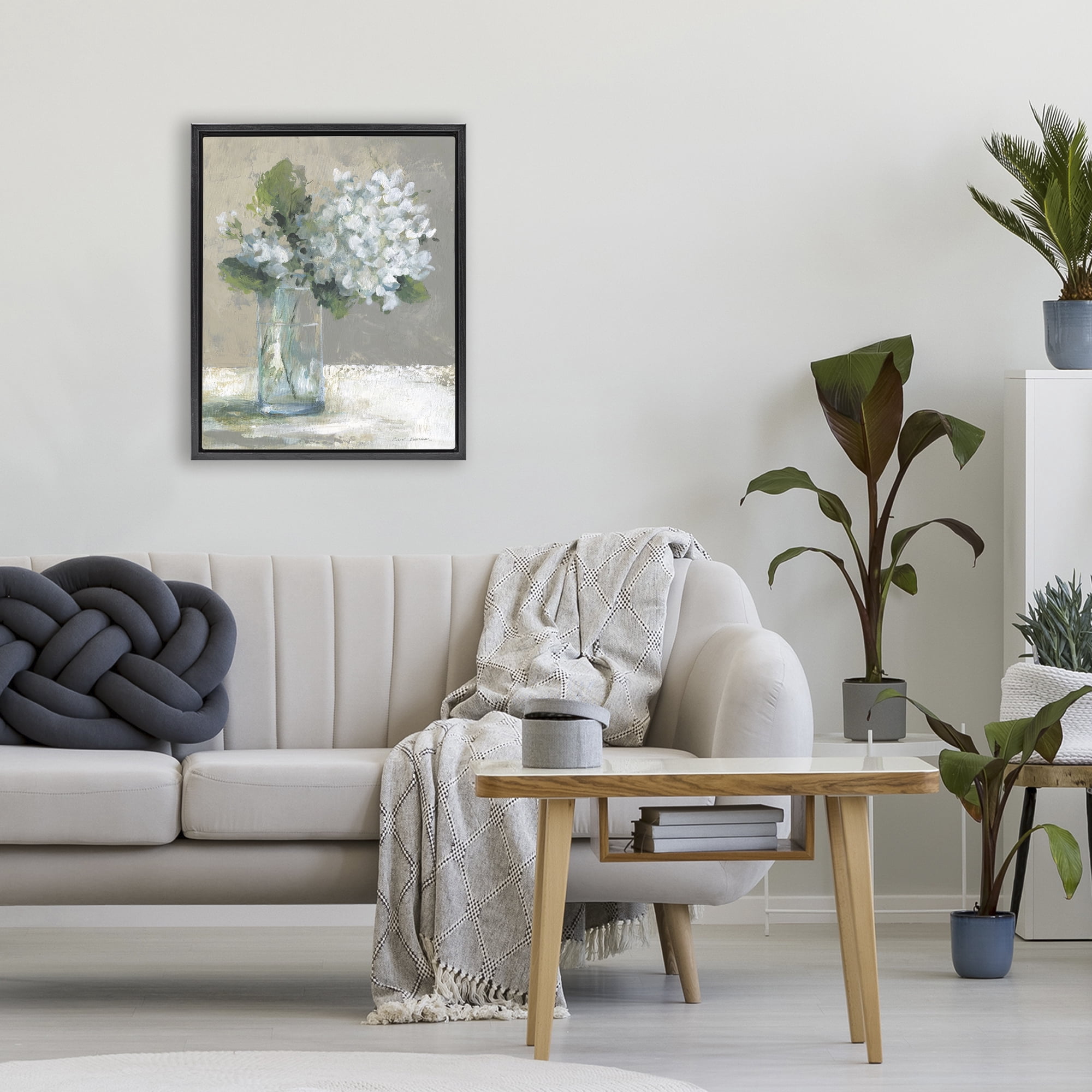 Stupell Industries Serene White Hydrangeas in Glass Black Framed Floater Canvas Wall Art, design by Carol Robinson