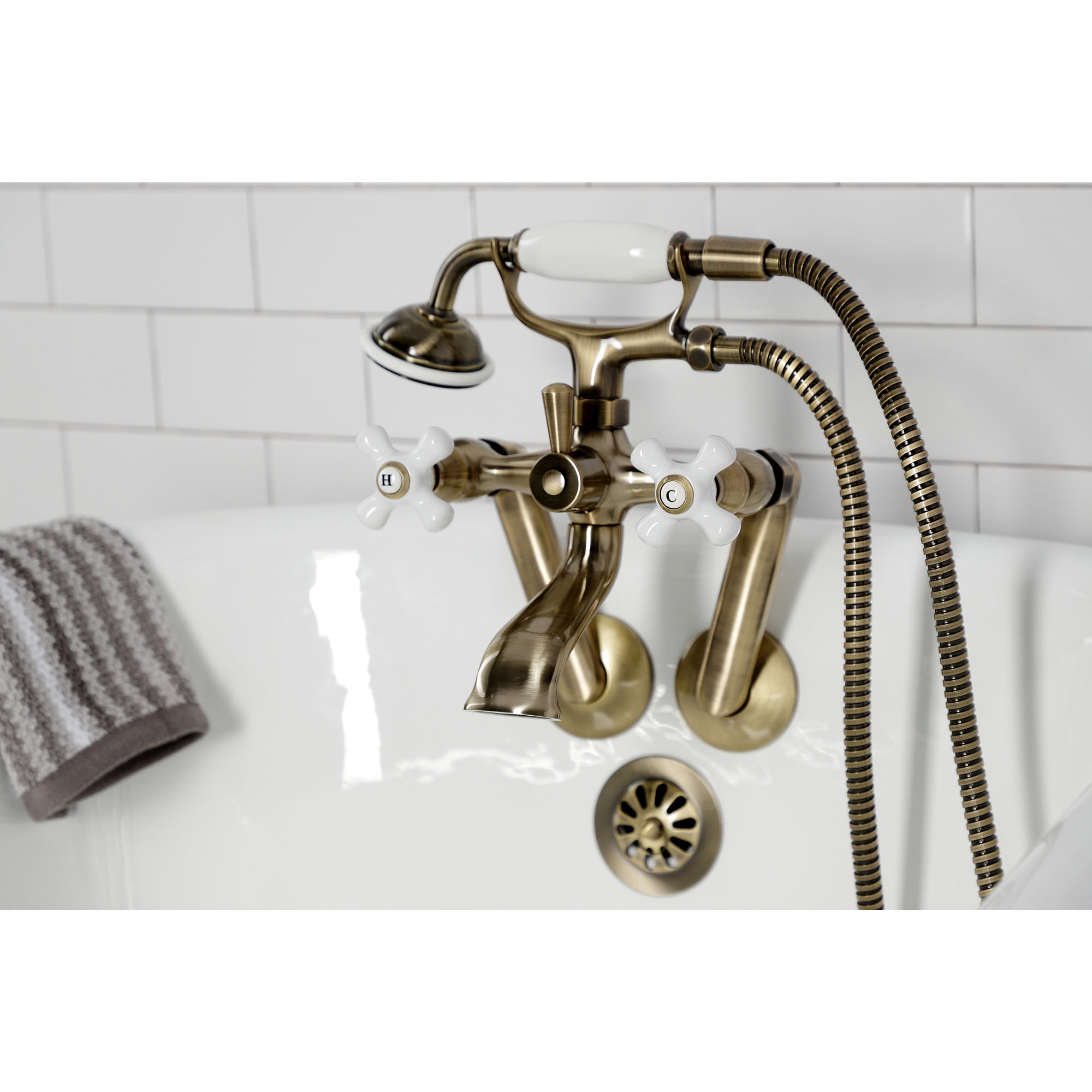 Kingston Brass KS269PXAB Kingston Three-Handle 2-Hole Tub Wall Mount Clawfoot Tub Faucet with Hand Shower in Antique Brass