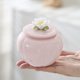 thumbnail image 1 of Lata sellada de lata de té Pink Nianhua: una lata de almacenamiento elegante y a prueba de humedad, adecuada for almacenar té, café, dulces y productos secos., 1 of 5