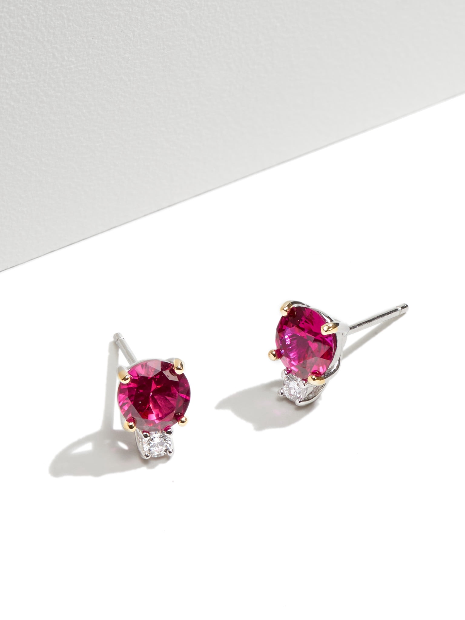 Forever Facets Jewelry Platinum Over Sterling Silver Created Ruby and 1/10th Carat Total Weight Lab Grown Diamond Two Stone Earrings (H-I Color, I1 Clarity)