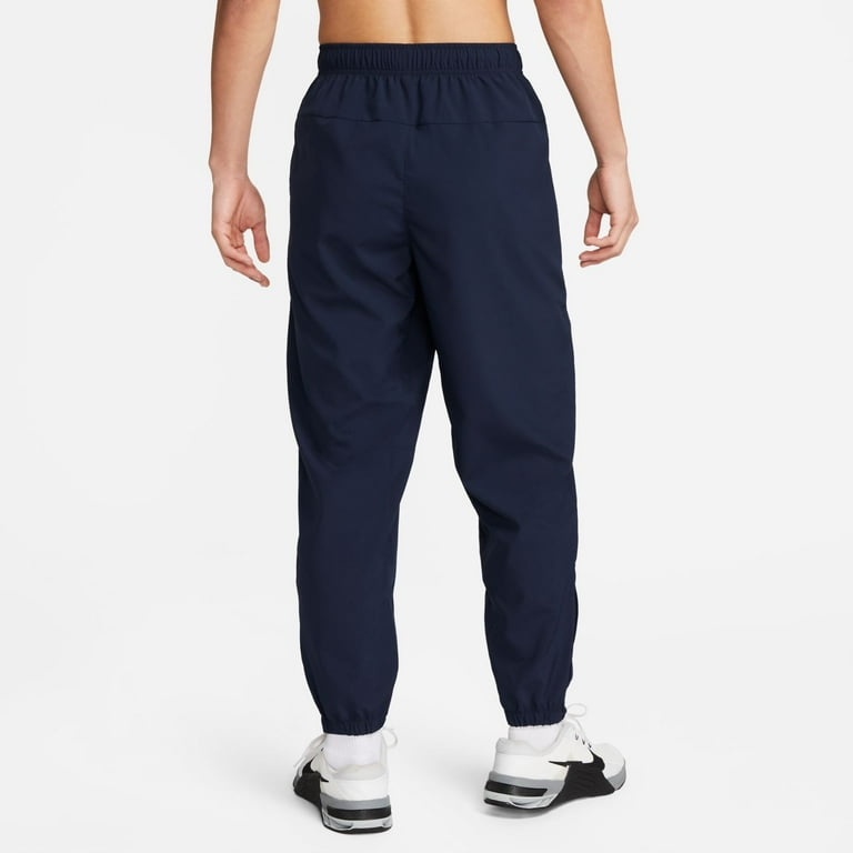 Men's Nike Form Dri-FIT Tapered Versatile Pants Color: Smoke Grey
