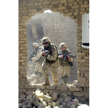 LAMINATED POSTER U.S. Army soldiers conduct house-to-house searches during Operation Baton Rouge, a joint combat oper Poster Print 24 x