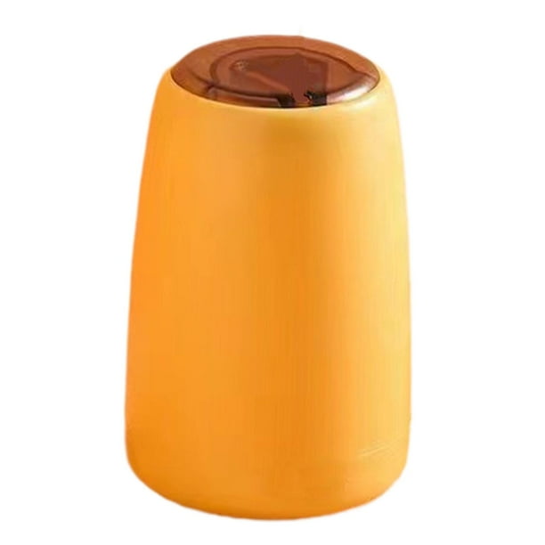 Dispensador de palillos de dientes. La caja de palillos se abre automáticamente para almacenarlos. Amarillo