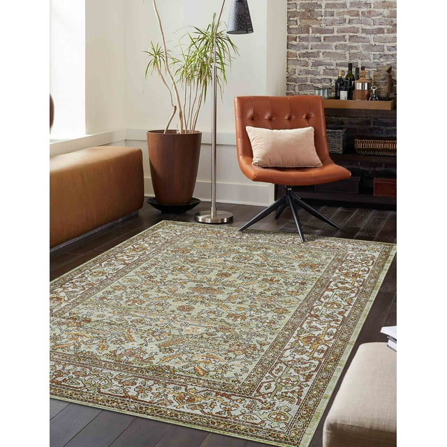 ECARPET Hailey traditional area rug featuring detailed floral motifs and a decorative border, displayed on dark wood flooring in a contemporary living space.