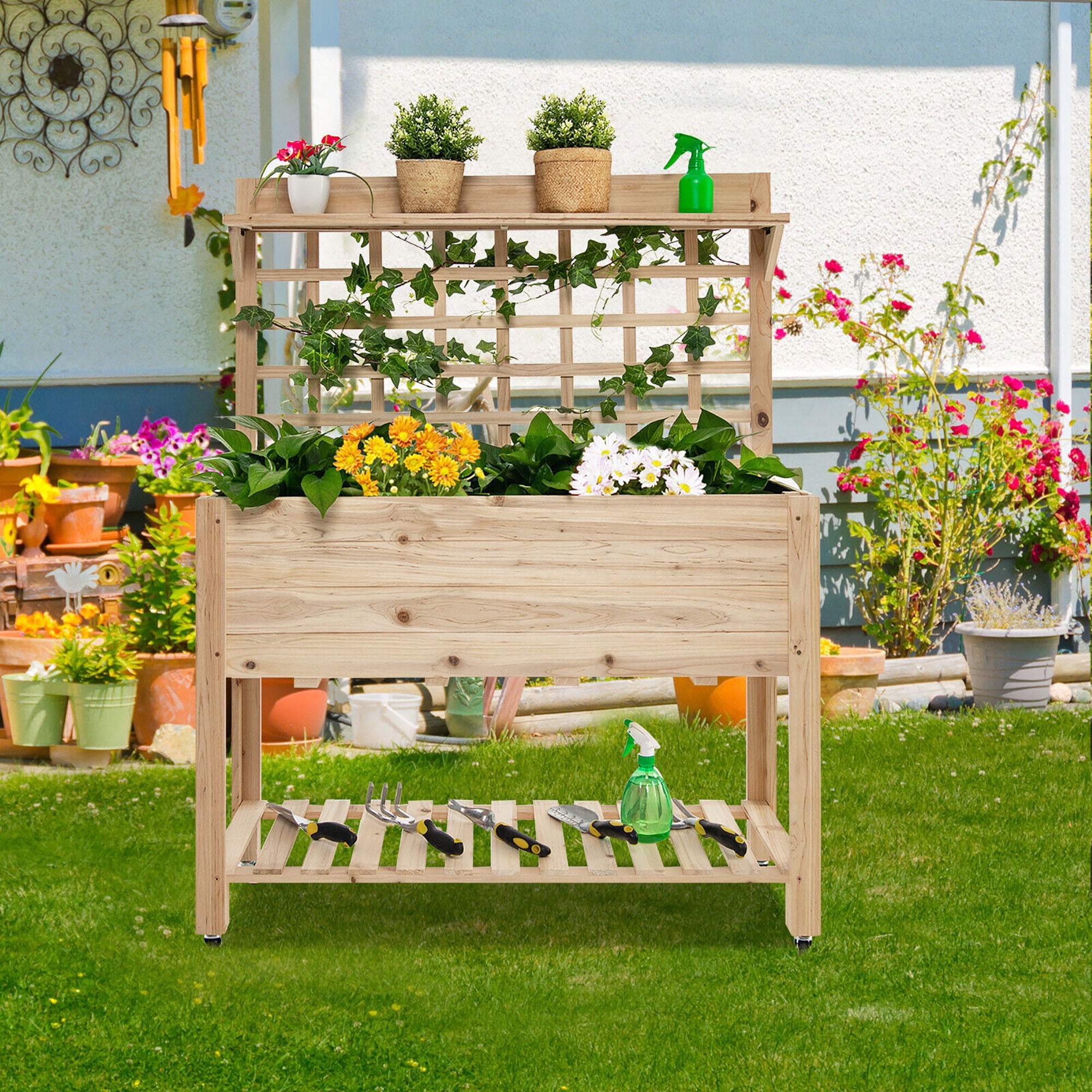 Image of Tiered garden bed made of tires with trellis