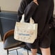 thumbnail image 2 of Organizador de ropa, almacenamiento de armario, bolso de moda, comercio exterior, ocio, viaje, bolsa de almuerzo, venta al por mayor, coreano, limpio, pequeño, fresco, todo a juego, bolso de lona, bol, 2 of 6
