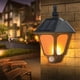 thumbnail image 1 of Luces solares para exteriores, apliques de pared decorativos con llama parpadeante y dos modos, para patio, garaje, jardín y puerta trasera y delantera., 1 of 7