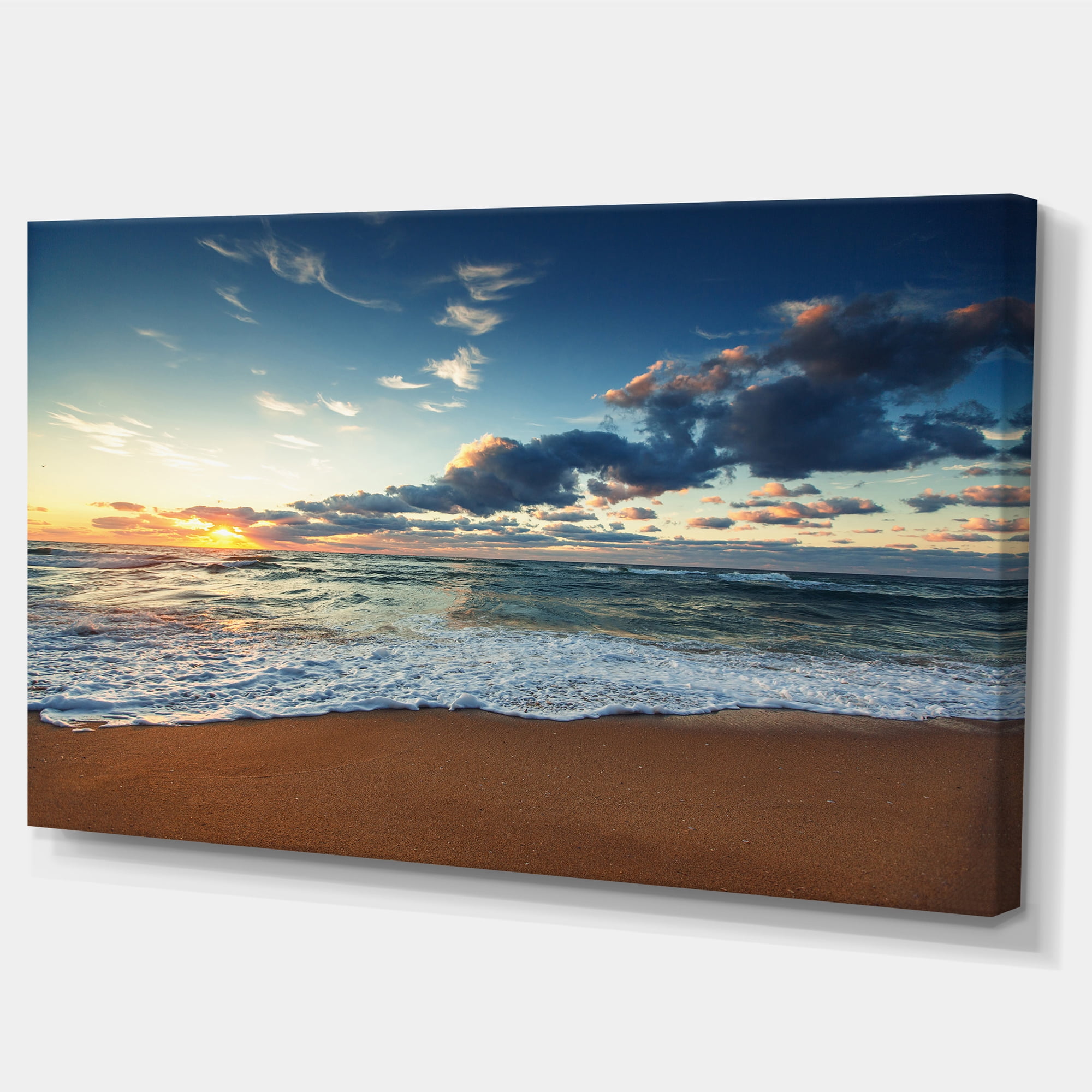 Designart 'Sunrise and Glowing Waves in Ocean ' Seascape Canvas Art Print