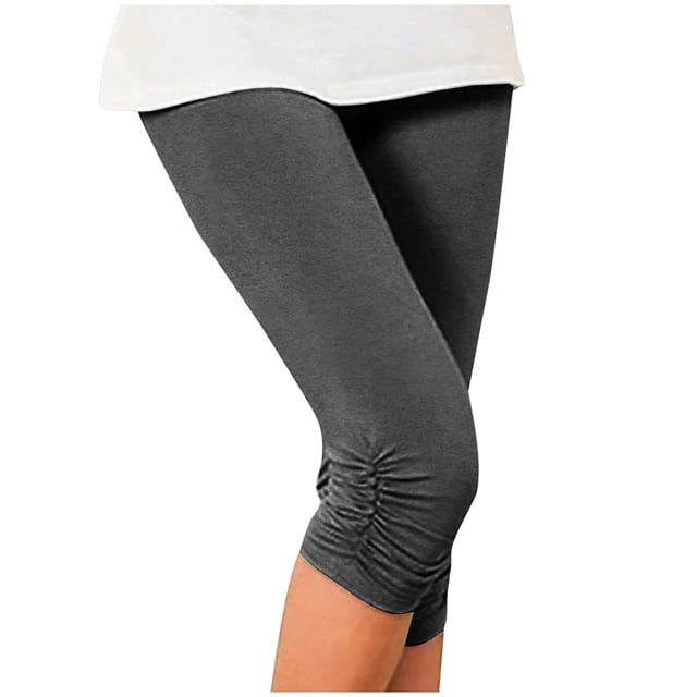 Stretch Soft High Waisted Capri Jeggings for women in black, featuring side ruching detail. Made of a breathable polyester, cotton, and spandex blend, these lightweight and stretchy leggings are designed for comfort and versatility. Shown in a cropped style, ideal for casual, summer, or beachwear. Keywords include leggings, capri pants, and summer wear. Size Large.