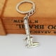 thumbnail image 3 of Llavero con forma de calibrador para parejas, llavero con forma de anillo, ideal para amantes., 3 of 4