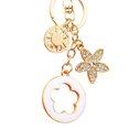 thumbnail image 5 of Backpack Accessory Keychain Charm with Gold Tone Flower Pendant, Round Attachment Loop and Lobster Clasp for Bags, 5 of 9
