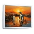 thumbnail image 2 of Designart "Playful Penguins In The Sunset Snow I" Penguin Floater Framed Canvas Art Print, 2 of 5