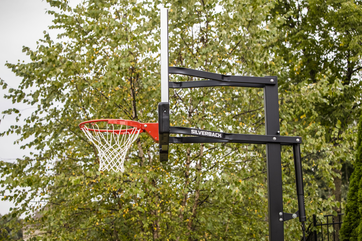 Silverback 54" In-Ground Height-Adjustable Basketball System with Tempered Glass Backboard, Anchor Mounting, and 5-year Limited Warranty - image 5 of 9