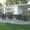Gray, variant on Emma + Oliver Set of 4 Adirondack Chairs with Cup Holders, Weather Resistant HDPE Adirondack Chairs in Red
