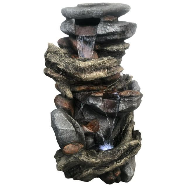 Angelo Décor Switchback Falls Fountain featuring cascading water over realistic rock and driftwood design with energy-efficient pump and LED lighting.