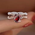 thumbnail image 2 of Divine Creation Women's 2.15 Ct Oval Cut Red Garnet Christmas Thanksgiving Engagement Bridal Ring Set 14K Rose Gold Plated 925 Sterling Silver -5.5, 2 of 3
