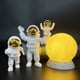 thumbnail image 4 of Juego de 4 estatuas de astronauta, adorno creativo para gabinete, conjunto de figuras de astronauta dorado, 4 of 9