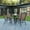 Brown, variant on BizChair 5 Piece Outdoor Patio Dining Set - 31.5" Round Tempered Glass Patio Table, 4 Gray Flex Comfort Stack Chairs