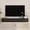 Black, variant on Floating TV Stand Wall Mounted with 16 Color LEDs, 69" Modern TV Stand, Mid-Century Curved TV Media Console with Sliding Doors, Black