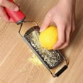 thumbnail image 1 of Aodebiao Stainless Steel Cheese Grater Zester, Multi-Purpose Kitchen Grater for Ginger, Chocolate, Nutmeg, Garlic, Carrot, Lemon, Non-Clogging Rust-Proof Handheld Grater with Storage Handle, 1 of 7
